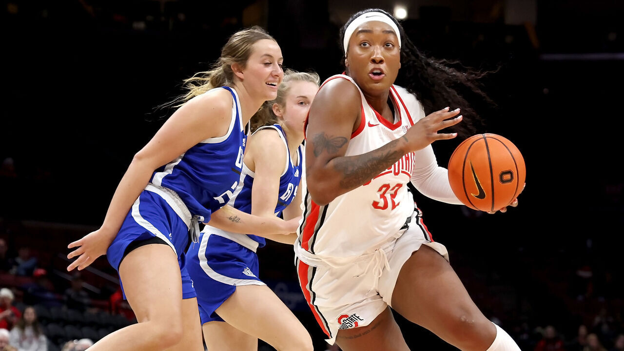 COLUMBUS, OHIO - DECEMBER 17: Cotie McMahon #32 of the Ohio State Buckeyes drives the ball past the defense of Abrie Cabana #21 of the Grand Valley State Lakers during the third quarter of the game at Value City Arena on December 17, 2024 in Columbus, Ohio. Ohio State defeated Grand Valley State 82-57.