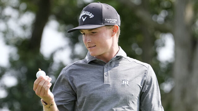 BLOOMFIELD HILLS, MICHIGAN - JULY 24: Blades Brown of the United States looks at a bee on his ball on the 13th tee during day three of the 76th U.S. Junior Amateur Championship on the South Course at Oakland Hills Country Club on July 24, 2024 in Bloomfield Hills, Michigan.