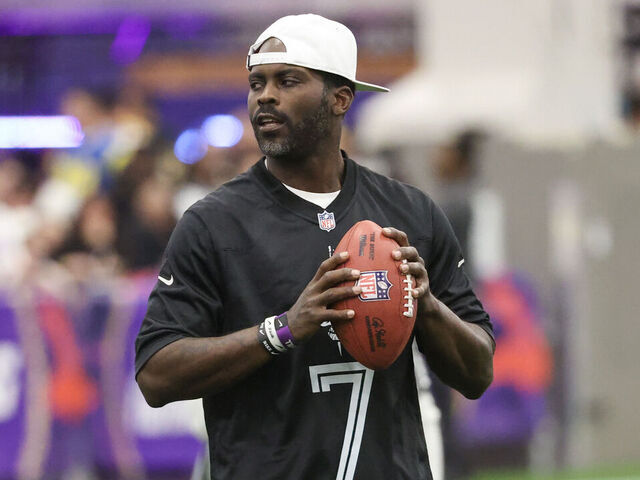 LAS VEGAS, NEVADA - FEBRUARY 09: Former NFL quarterback Michael Vick attempts a pass during a celebrity flag football game at the Mandalay Bay Convention Center on February 09, 2024 in Las Vegas, Nevada.