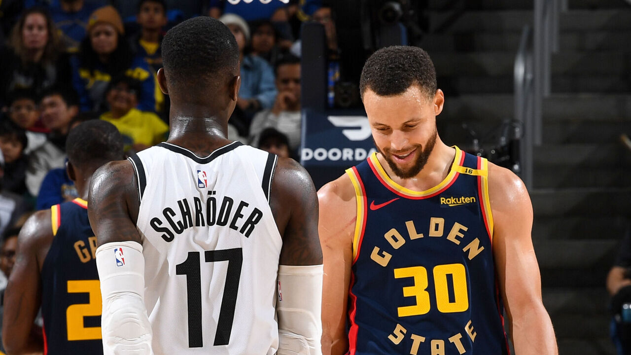 SAN FRANCISCO, CA - NOVEMBER 25: Dennis Schroder #17 of the Brooklyn Nets and Stephen Curry #30 of the Golden State Warriors look on during the game on November 25, 2024 at Chase Center in San Francisco, California. NOTE TO USER: User expressly acknowledges and agrees that, by downloading and or using this photograph, user is consenting to the terms and conditions of Getty Images License Agreement. Mandatory Copyright Notice: Copyright 2024 NBAE