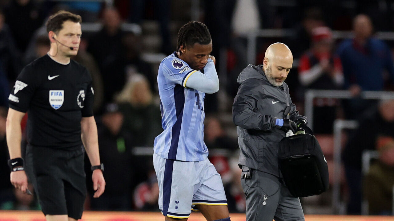 SOUTHAMPTON, ENGLAND - DECEMBER 15: An injured Destiny Udogie of Tottenham Hotspur goes o during the Premier League match between Southampton FC and Tottenham Hotspur FC at St Mary's Stadium on December 15, 2024 in Southampton, England.