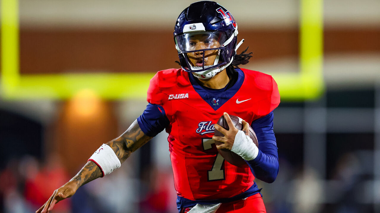 LYNCHBURG, VIRGINIA - OCTOBER 30: Kaidon Salter #7 of the Liberty Flames runs the ball during the first half of a football game against the Jacksonville State Gamecocks at Williams Stadium on October 30, 2024 in Lynchburg, Virginia.