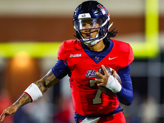 LYNCHBURG, VIRGINIA - OCTOBER 30: Kaidon Salter #7 of the Liberty Flames runs the ball during the first half of a football game against the Jacksonville State Gamecocks at Williams Stadium on October 30, 2024 in Lynchburg, Virginia.