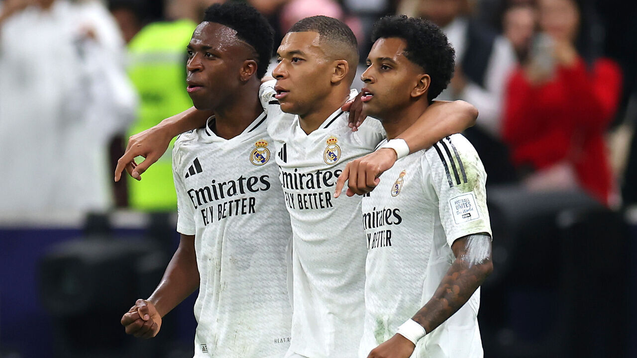 DOHA, QATAR - DECEMBER 18: Kylian Mbappe of Real Madrid celebrates with teammates Vinicius Junior and Rodrygo after scoring his team's first goal during the FIFA Intercontinental Cup between Real Madrid and CF Pachuca at Lusail Stadium on December 18, 2024 in Doha, Qatar.