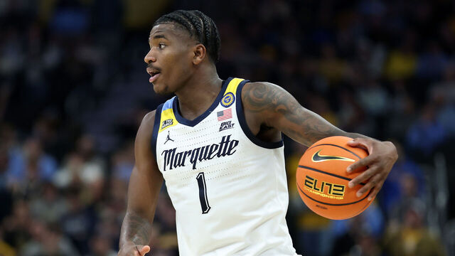 MILWAUKEE, WISCONSIN - DECEMBER 18: Kam Jones #1 of the Marquette Golden Eagles handles the ball during the first half of a game against the Butler Bulldogs at Fiserv Forum on December 18, 2024 in Milwaukee, Wisconsin.