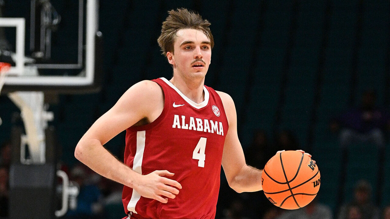 LAS VEGAS, NV - NOVEMBER 27: Alabama Crimson Tide forward Grant Nelson (4) dribbles up the court during the Players Era Festival college basketball game between Rutgers Scarlet Knights vs Alabama Crimson Tide on November 27, 2024 at MGM Grand Arena in Las Vegas, NV.