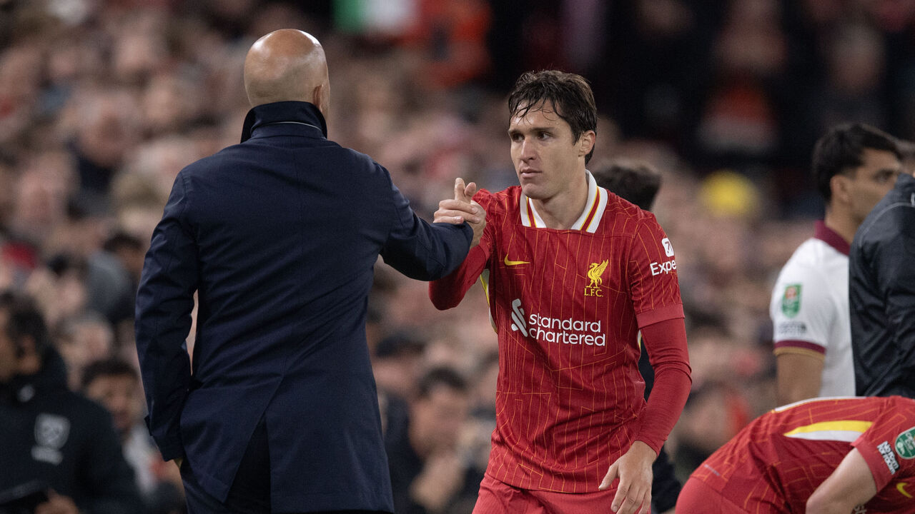 LIVERPOOL, ENGLAND - SEPTEMBER 25: Federico Chiesa of Liverpool is greeted by manager Arne Slot after being substituted during the Carabao Cup Third Round match between Liverpool and West Ham United at Anfield on September 25, 2024 in Liverpool, England.
