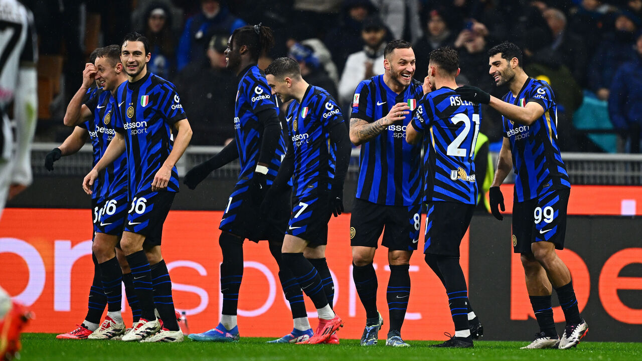 MILAN, ITALY - DECEMBER 19: Kristjan Asllani of FC Internazionale celebrates with team-mates after scoring the goal during the Coppa Italia match between FC Internazionale and Udinese Calcio at Stadio Giuseppe Meazza on December 19, 2024 in Milan, Italy.