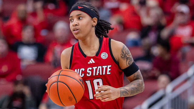 LOUISVILLE, KENTUCKY - DECEMBER 15: Aziaha James #10 of the NC State Wolfpack brings the ball up court during the game against the Louisville Cardinals at KFC YUM! Center on December 15, 2024 in Louisville, Kentucky.