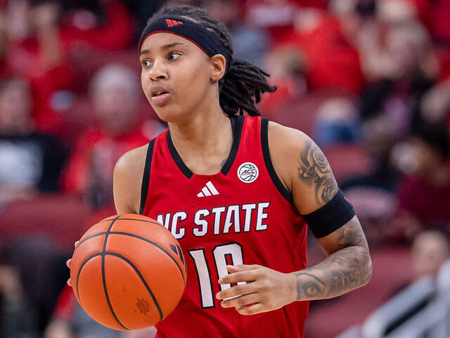 LOUISVILLE, KENTUCKY - DECEMBER 15: Aziaha James #10 of the NC State Wolfpack brings the ball up court during the game against the Louisville Cardinals at KFC YUM! Center on December 15, 2024 in Louisville, Kentucky.