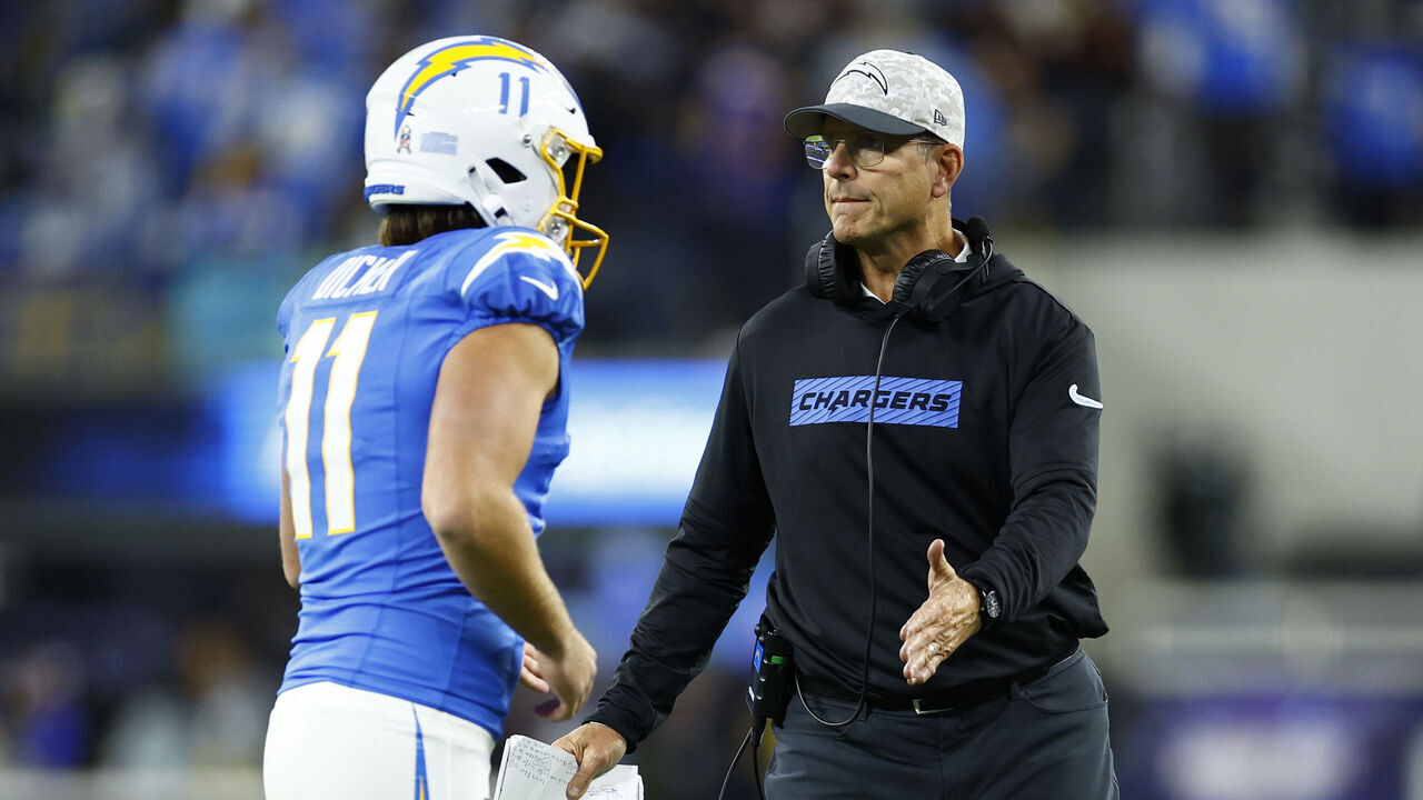 INGLEWOOD, CALIFORNIA - NOVEMBER 17: Head coach Jim Harbaugh of the Los Angeles Chargers congratulates Cameron Dicker #11 after his successful field goal against the Cincinnati Bengals during the second quarter at SoFi Stadium on November 17, 2024 in Inglewood, California.