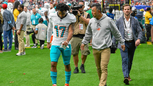 HOUSTON, TX - DECEMBER 15: Miami Dolphins wide receiver Jaylen Waddle (17) is led to the locker room after being injured during the football game between the Miami Dolphins and Houston Texans on December 15, 2024, at NRG Stadium in Houston, Texas.
