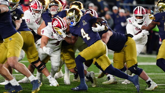 SOUTH BEND, IN - DECEMBER 20: Notre Dame Fighting Irish running back Jeremiyah Love (4) breaks a 98 yard run for a touchdown against the Indiana Hoosiers on December 20, 2024, during the CFP First Round playoff game at Notre Dame Stadium in South Bend, Indiana.