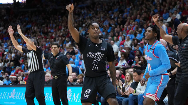 CINCINNATI, OHIO - DECEMBER 20: Jizzle James #2 of the Cincinnati Bearcats celebrates after making a shot in the second half against the Dayton Flyers at the Heritage Bank Center on December 20, 2024 in Cincinnati, Ohio.