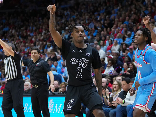 CINCINNATI, OHIO - DECEMBER 20: Jizzle James #2 of the Cincinnati Bearcats celebrates after making a shot in the second half against the Dayton Flyers at the Heritage Bank Center on December 20, 2024 in Cincinnati, Ohio.