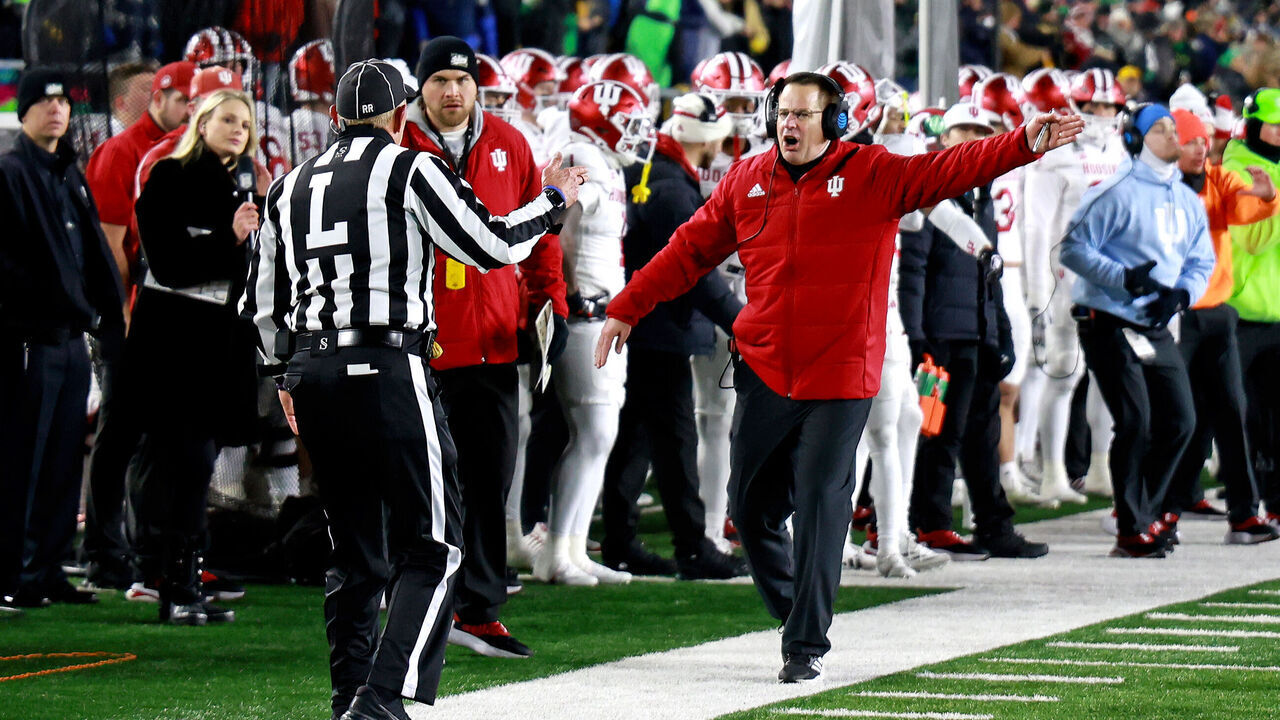 SOUTH BEND, IN - DECEMBER 20: Indiana Hoosiers coach Curt Cignetti yells at a referee during a game against the Notre Dame Fighting Irish on December 20, 2024, during the CFP First Round playoff game at Notre Dame Stadium in South Bend, Indiana.