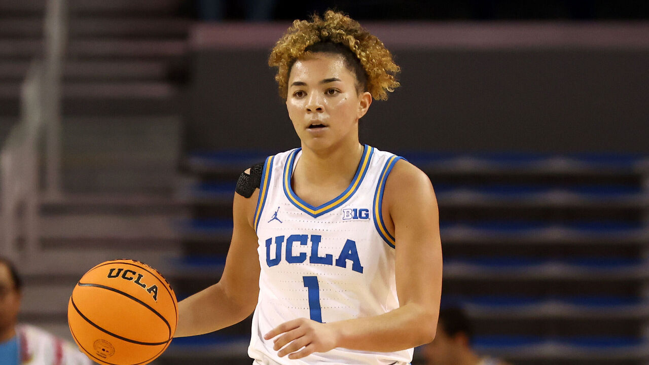 LOS ANGELES, CALIFORNIA - DECEMBER 16: Kiki Rice #1 of the UCLA Bruins brings the ball up court against the Cal Poly Mustangs during the third quarter at UCLA Pauley Pavilion on December 16, 2024 in Los Angeles, California.