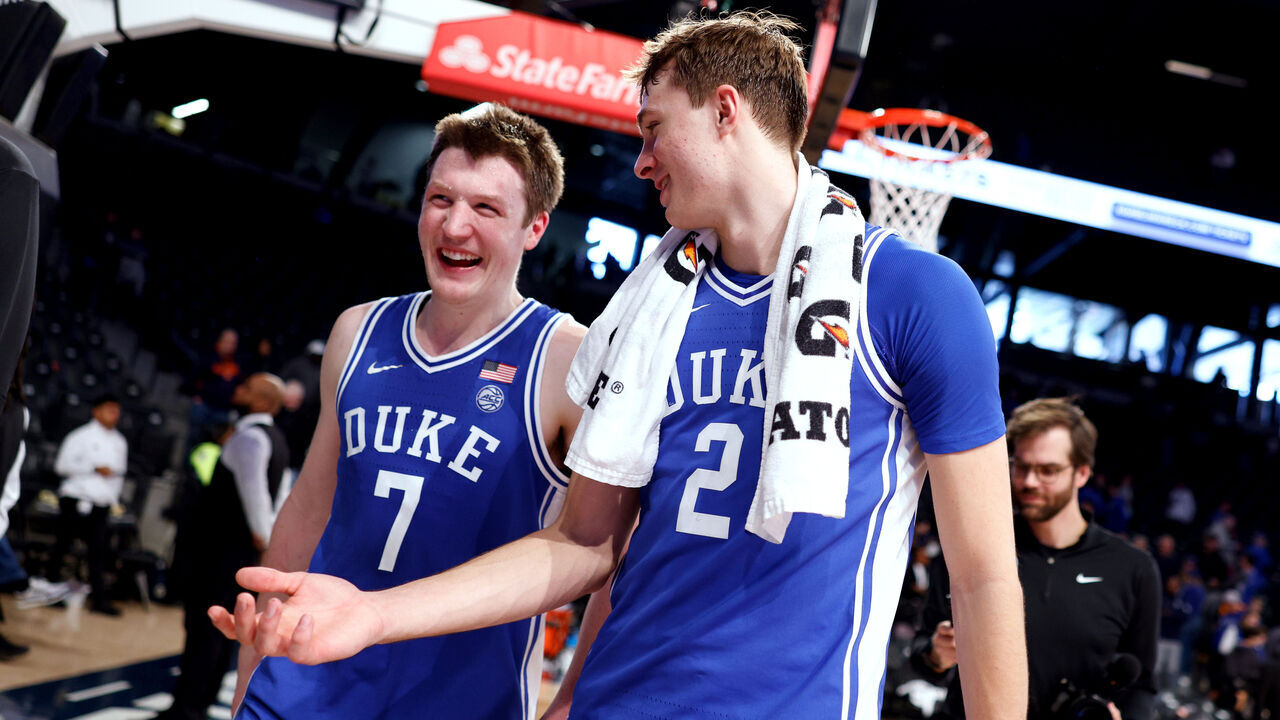 ATLANTA, GEORGIA - DECEMBER 21: Kon Knueppel #7 and Cooper Flagg #2 of the Duke Blue Devils walk off the court following their 82-56 victory against the Georgia Tech Yellow Jackets at McCamish Pavilion on December 21, 2024 in Atlanta, Georgia.