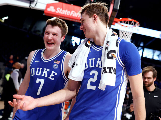 ATLANTA, GEORGIA - DECEMBER 21: Kon Knueppel #7 and Cooper Flagg #2 of the Duke Blue Devils walk off the court following their 82-56 victory against the Georgia Tech Yellow Jackets at McCamish Pavilion on December 21, 2024 in Atlanta, Georgia.
