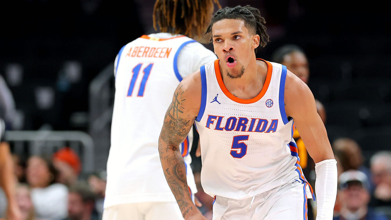 ATLANTA, GEORGIA - DECEMBER 14: Will Richard #5 of the Florida Gators celebrates against the Arizona State Sun Devils during the second half in the Holiday Hoopsgiving Atlanta at State Farm Arena on December 14, 2024 in Atlanta, Georgia.
