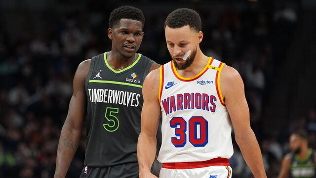 MINNEAPOLIS, MN - DECEMBER 21: Anthony Edwards #5 of the Minnesota Timberwolves and Stephen Curry #30 of the Golden State Warriors look on after the game on December 21, 2024 at Target Center in Minneapolis, Minnesota. Mandatory Copyright Notice: Copyright 2024 NBAE