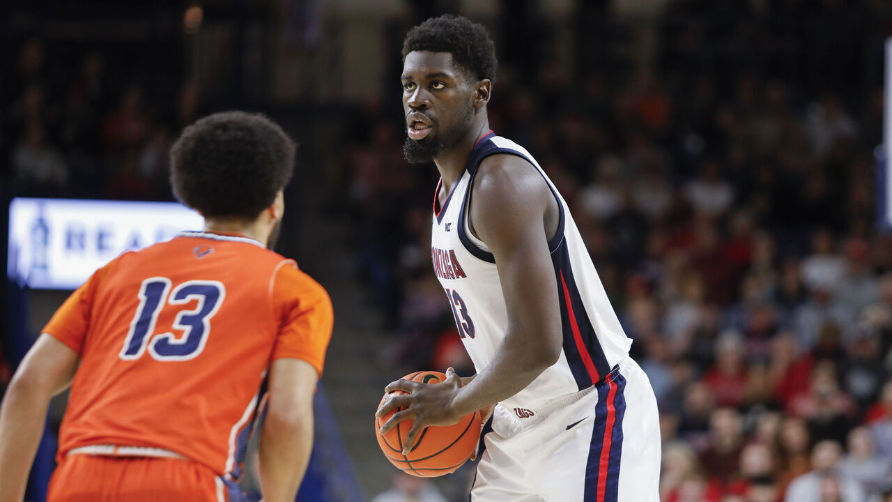 SPOKANE, WA - DECEMBER 21: Gonzaga Bulldogs forward Graham Ike (13) holds the ball while looking for a play during the game between the Gonzaga Bulldogs and the Bucknell Bison at McCarthy Athletic Center in Spokane, WA, on December 21, 2024.