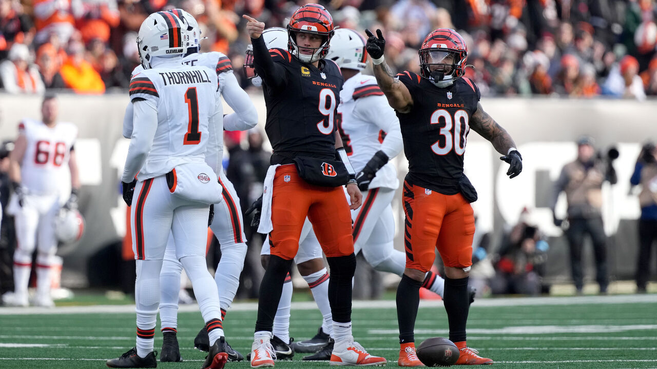 CINCINNATI, OHIO - DECEMBER 22: Joe Burrow #9 and Chase Brown #30 of the Cincinnati Bengals celebrate a first down against the Cleveland Browns during the second quarter at Paycor Stadium on December 22, 2024 in Cincinnati, Ohio.