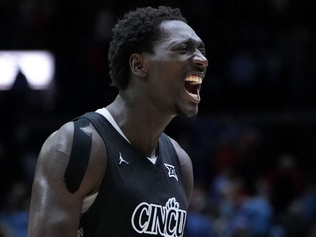 CINCINNATI, OHIO - DECEMBER 20: Aziz Bandaogo #55 of the Cincinnati Bearcats celebrates after beating the Dayton Flyers 66-59 at the Heritage Bank Center on December 20, 2024 in Cincinnati, Ohio.