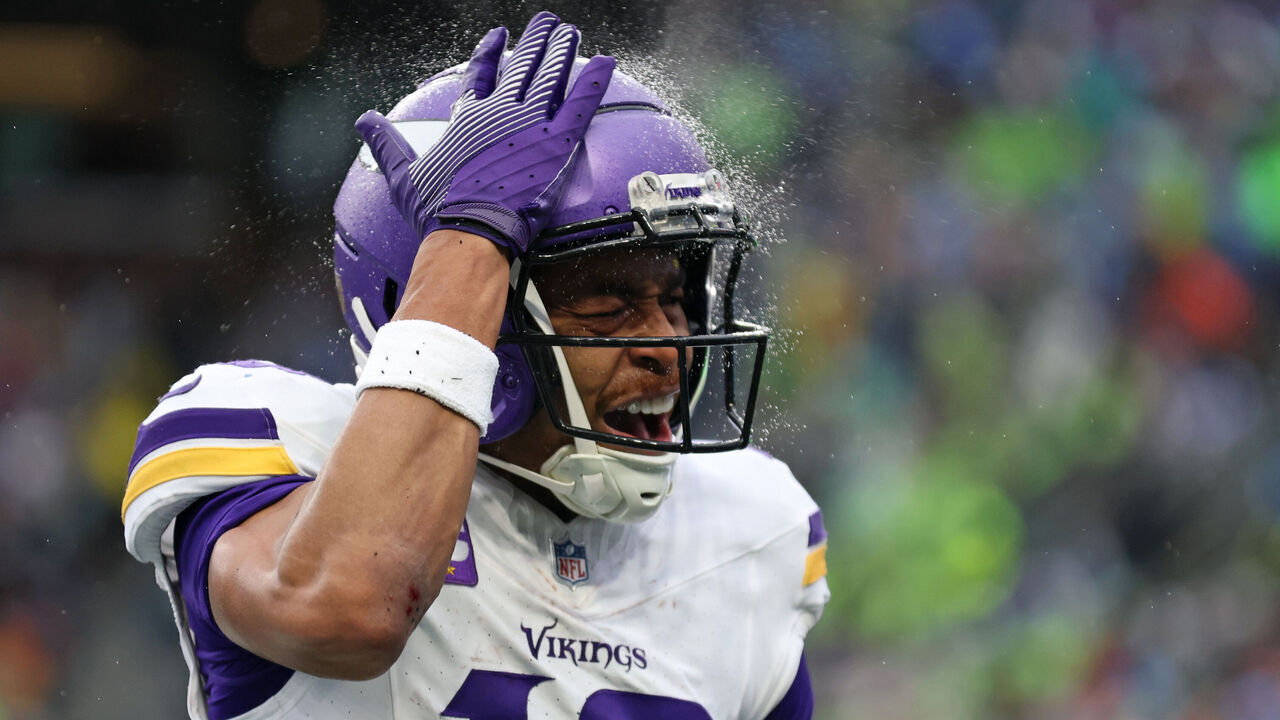SEATTLE, WASHINGTON - DECEMBER 22: Justin Jefferson #18 of the Minnesota Vikings celebrates after his touchdown reception against the Seattle Seahawks during the second quarter at Lumen Field on December 22, 2024 in Seattle, Washington.