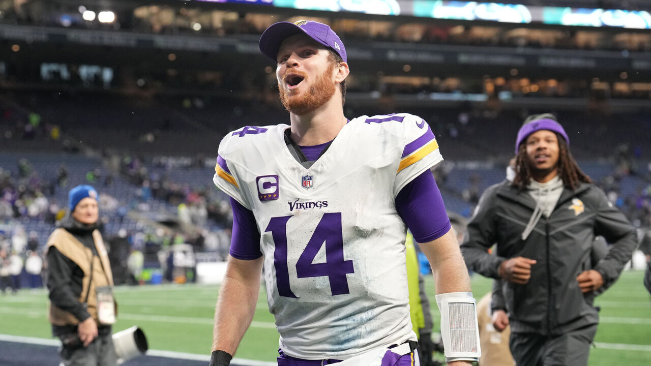 SEATTLE, WASHINGTON - DECEMBER 22: Sam Darnold #14 of the Minnesota Vikings celebrates as he leaves the field after his team defeated the Seattle Seahawks at Lumen Field on December 22, 2024 in Seattle, Washington.