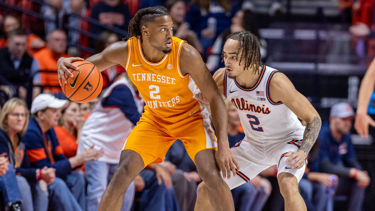 CHAMPAIGN, ILLINOIS - DECEMBER 14: Chaz Lanier #2 of the Tennessee Volunteers dribbles against Dra Gibbs-Lawhorn #2 of the Illinois Fighting Illini at State Farm Center on December 14, 2024 in Champaign, Illinois.