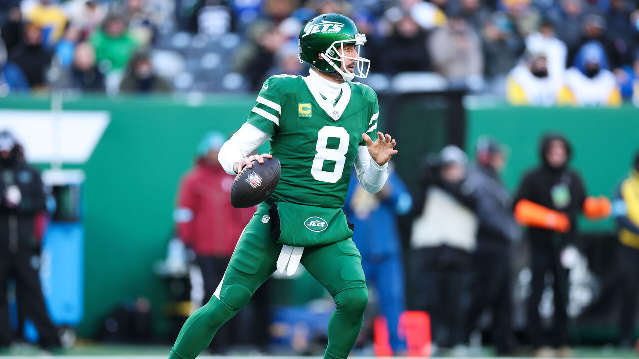 EAST RUTHERFORD, NEW JERSEY - DECEMBER 22: Aaron Rodgers #8 of the New York Jets looks to throw the football during the second quarter against the Los Angeles Rams at MetLife Stadium on December 22, 2024 in East Rutherford, New Jersey.
