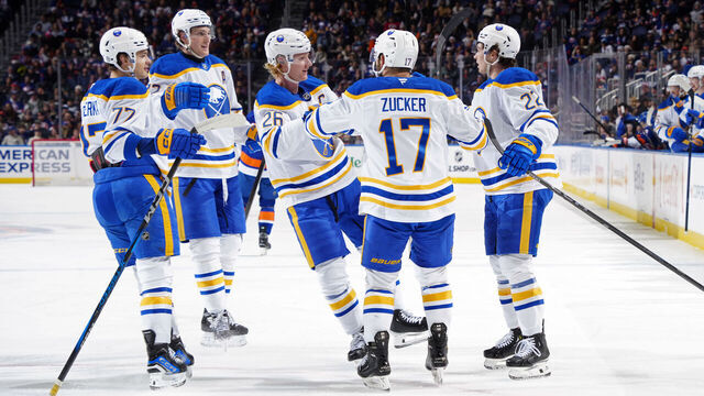 ELMONT, NEW YORK - DECEMBER 23: Jason Zucker #17 of the Buffalo Sabres is congratulated by his teammates after scoring a goal against the New York Islanders during the second period at UBS Arena on December 23, 2024 in Elmont, New York.