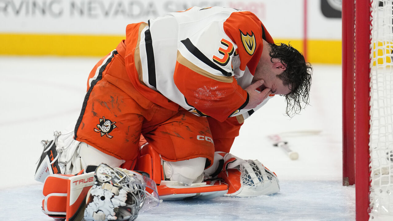LAS VEGAS, NEVADA - DECEMBER 23: John Gibson #36 of the Anaheim Ducks reacts after taking an inadvertent stick in the eye during the first period against the Vegas Golden Knights at T-Mobile Arena on December 23, 2024 in Las Vegas, Nevada.