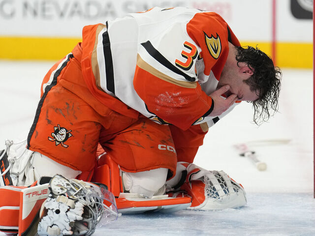LAS VEGAS, NEVADA - DECEMBER 23: John Gibson #36 of the Anaheim Ducks reacts after taking an inadvertent stick in the eye during the first period against the Vegas Golden Knights at T-Mobile Arena on December 23, 2024 in Las Vegas, Nevada.