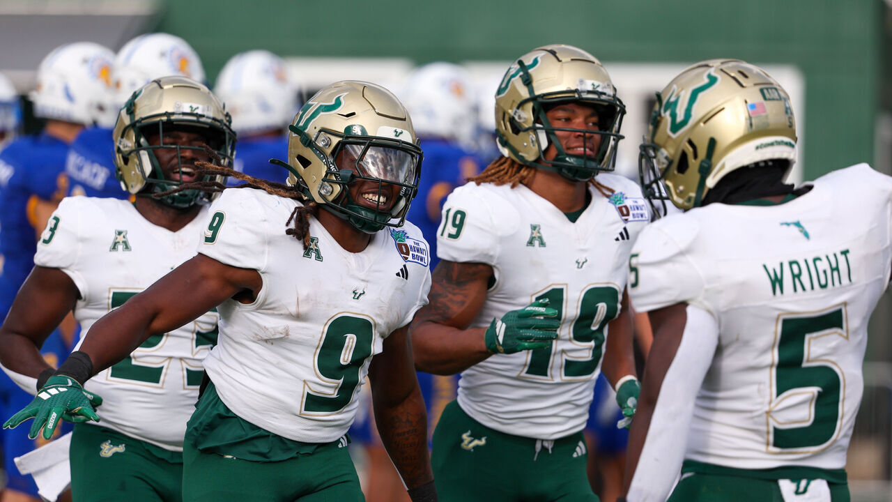 HONOLULU, HAWAII - DECEMBER 24: Ta'Ron Keith #9 of the South Florida Bulls celebrates with Nay'Quan Wright #5 after scoring a touchdown during the first half of the game against the San Jose Spartans at the Clarence T.C. Ching Athletics Complex on December 24, 2024 in Honolulu, Hawaii. (Photo by Darryl Oumi/Getty Image