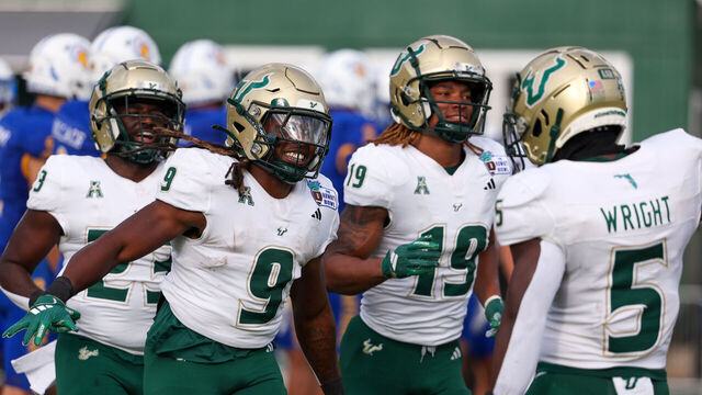 HONOLULU, HAWAII - DECEMBER 24: Ta'Ron Keith #9 of the South Florida Bulls celebrates with Nay'Quan Wright #5 after scoring a touchdown during the first half of the game against the San Jose Spartans at the Clarence T.C. Ching Athletics Complex on December 24, 2024 in Honolulu, Hawaii. (Photo by Darryl Oumi/Getty Image