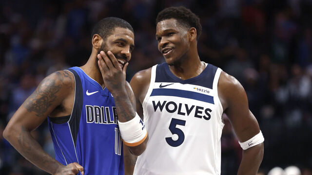 DALLAS, TX -DECEMBER 25 : Kyrie Irving #11 of the Dallas Mavericks and Anthony Edwards #5 of the Minnesota Timberwolves talk late in the second half at American Airlines Center on December 25, 2024 in Dallas, Texas.