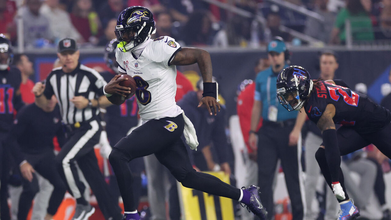 HOUSTON, TEXAS - DECEMBER 25: Lamar Jackson #8 of the Baltimore Ravens runs the ball for a touchdown during the third quarter against the Houston Texans at NRG Stadium on December 25, 2024 in Houston, Texas.