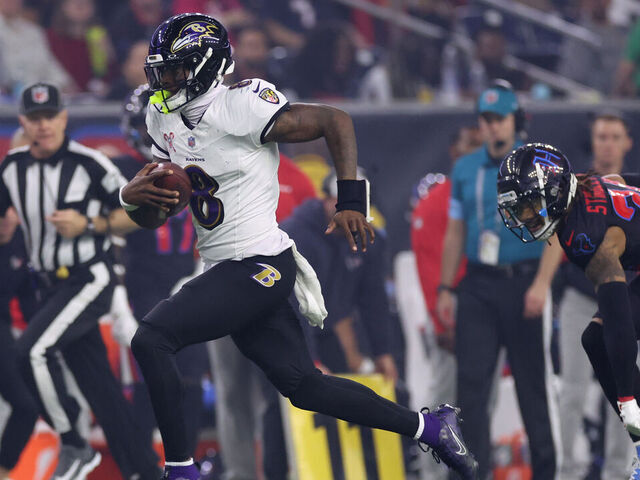HOUSTON, TEXAS - DECEMBER 25: Lamar Jackson #8 of the Baltimore Ravens runs the ball for a touchdown during the third quarter against the Houston Texans at NRG Stadium on December 25, 2024 in Houston, Texas.