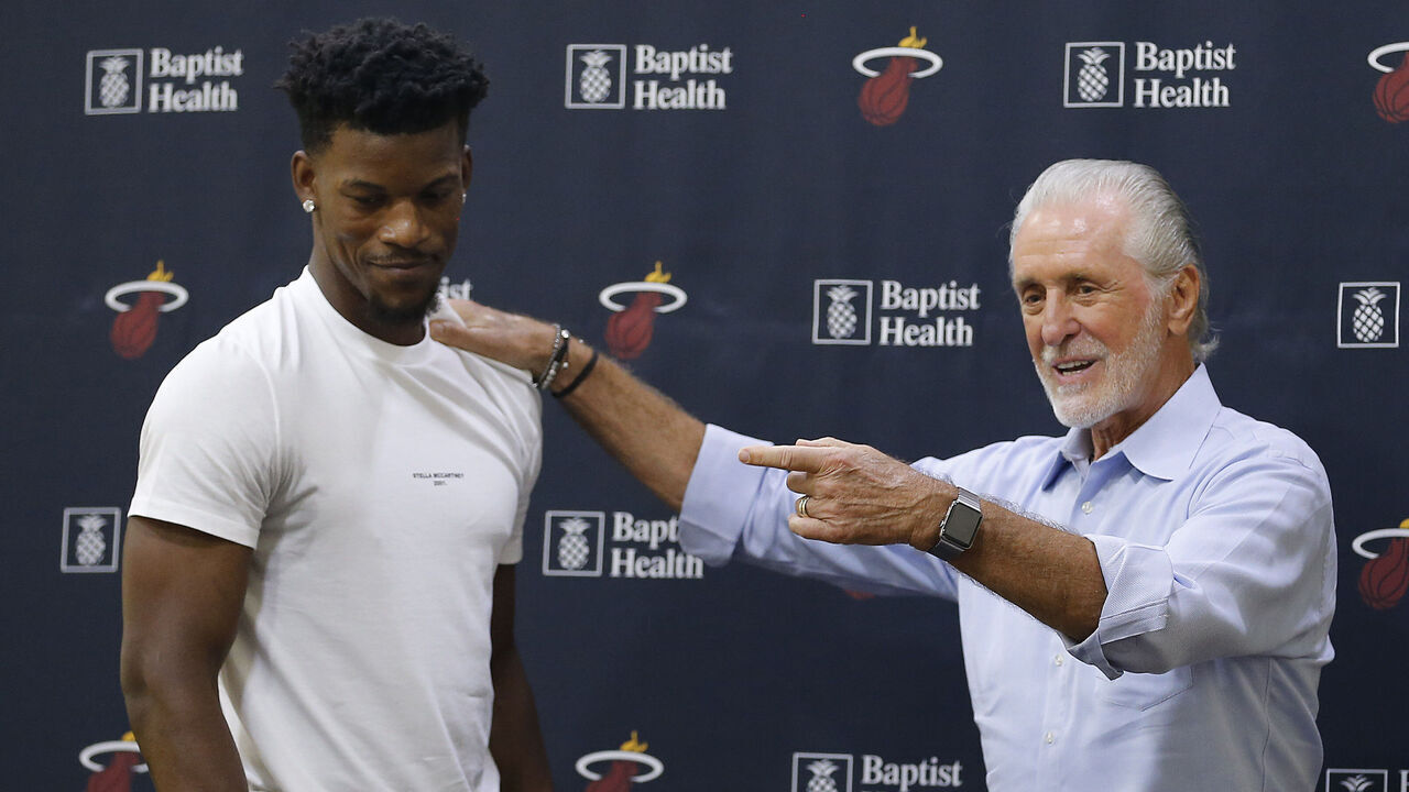 MIAMI, FLORIDA - SEPTEMBER 27: Jimmy Butler #22 of the Miami Heat hugs president Pat Riley after his introductory press conference at American Airlines Arena on September 27, 2019 in Miami, Florida.
