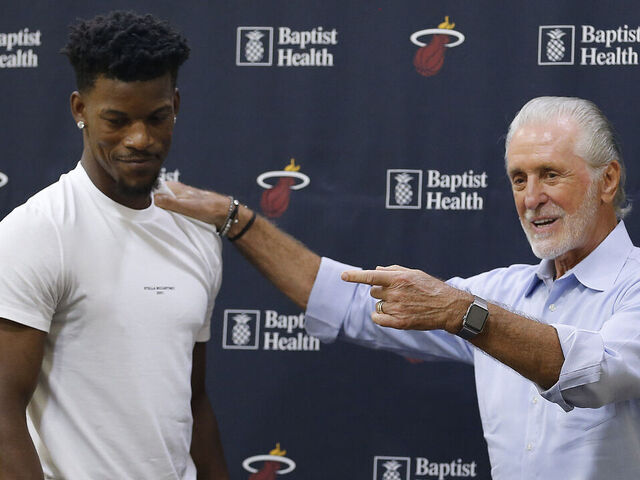 MIAMI, FLORIDA - SEPTEMBER 27: Jimmy Butler #22 of the Miami Heat hugs president Pat Riley after his introductory press conference at American Airlines Arena on September 27, 2019 in Miami, Florida.