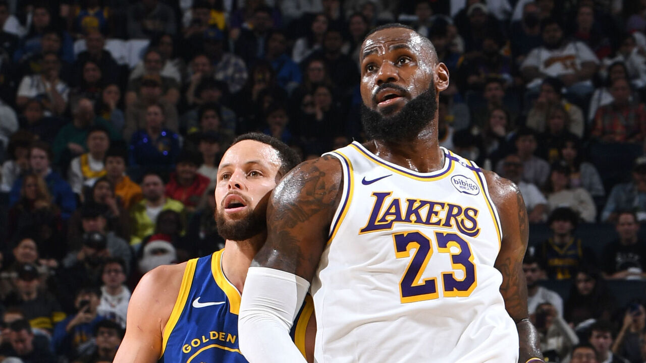 SAN FRANCISCO, CA - DECEMBER 25: Stephen Curry #30 of the Golden State Warriors and LeBron James #23 of the Los Angeles Lakers look on during the game on December 25, 2024 at Chase Center in San Francisco, California. NOTE TO USER: User expressly acknowledges and agrees that, by downloading and or using this photograph, user is consenting to the terms and conditions of Getty Images License Agreement. Mandatory Copyright Notice: Copyright 2024 NBAE
