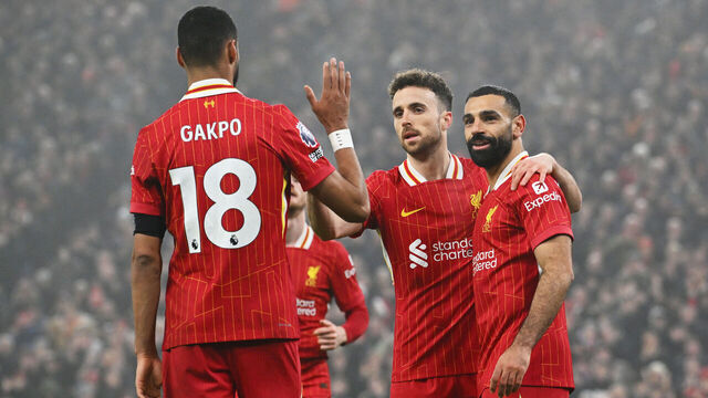 LIVERPOOL, ENGLAND - DECEMBER 26: (THE SUN OUT, THE SUN ON SUNDAY OUT) Mohamed Salah of Liverpool (R) celebrates scoring his team's third goal with teammates during the Premier League match between Liverpool FC and Leicester City FC at Anfield on December 26, 2024 in Liverpool, England.