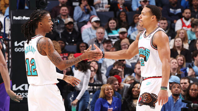 MEMPHIS, TN - December 26: Ja Morant #12 and Desmond Bane #22 of the Memphis Grizzlies high five during the game against the Toronto Raptors on December 26, 2024 at FedExForum in Memphis, Tennessee. Mandatory Copyright Notice: Copyright 2024 NBAE