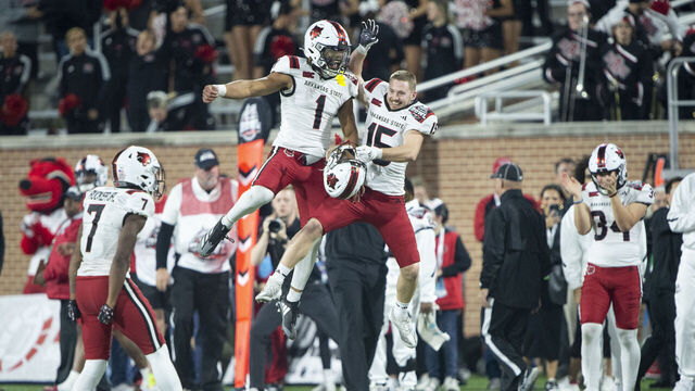 MOBILE, ALABAMA - DECEMBER 26: Wide receiver Reagan Ealy #15 of the Arkansas State Red Wolves celebrates with quarterback Jaylen Raynor #1 after defeating the Bowling Green Falcons in the 68 Ventures Bowl at Hancock Whitney Stadium on December 26, 2024 in Mobile, Alabama.