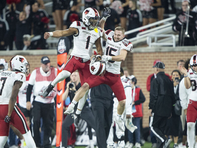 MOBILE, ALABAMA - DECEMBER 26: Wide receiver Reagan Ealy #15 of the Arkansas State Red Wolves celebrates with quarterback Jaylen Raynor #1 after defeating the Bowling Green Falcons in the 68 Ventures Bowl at Hancock Whitney Stadium on December 26, 2024 in Mobile, Alabama.