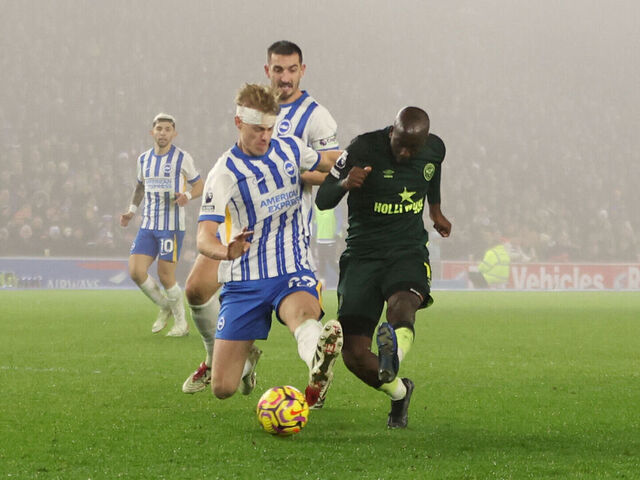 Brentford's Yoane Wissa (right) has a shot on goal past Brighton and Hove Albion's Jan Paul van Hecke (left) during the Premier League match at the Amex Stadium, Brighton and Hove. Picture date: Friday December 27, 2024.