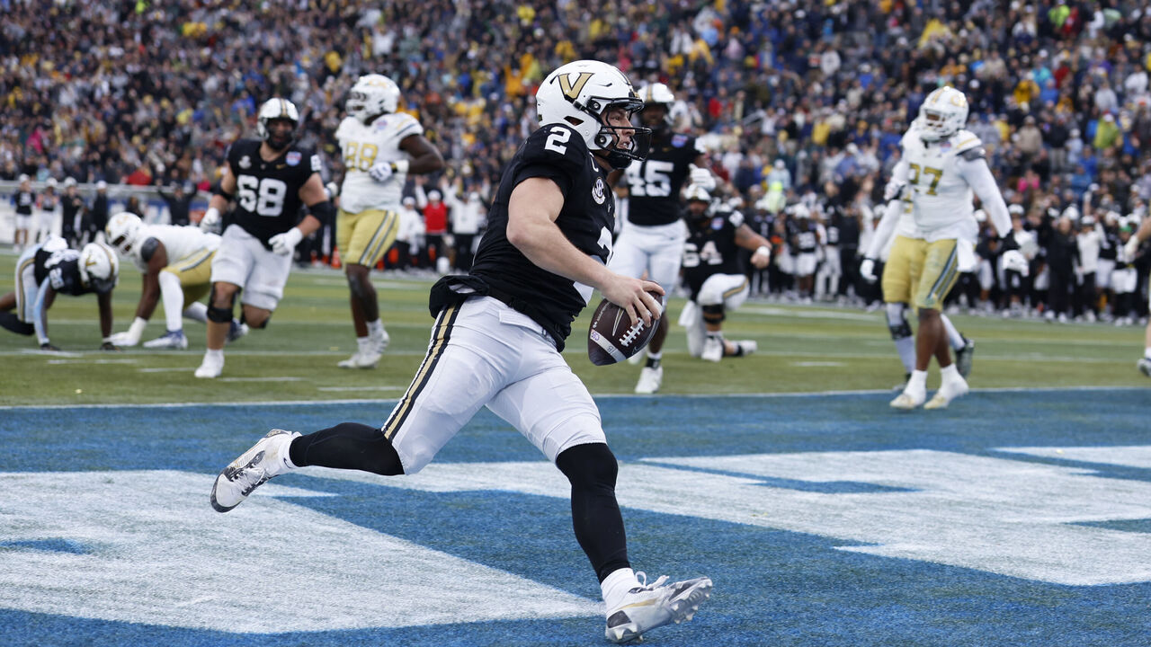 BIRMINGHAM, AL - DECEMBER 27: Vanderbilt Commodores quarterback Diego Pavia (2) scores a touchdown during the Birmingham Bowl between the Vanderbilt Commodores and Georgia Tech Yellow Jackets, December 27, 2024 at Protective Stadium in Birmingham, Alabama.