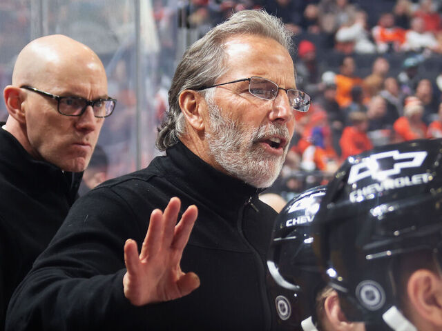 PHILADELPHIA, PENNSYLVANIA - DECEMBER 08: Head Coach of the Philadelphia Flyers John Tortorella gives instruction from his bench during the first period of his team's game against the Utah Hockey Club at the Wells Fargo Center on December 8, 2024 in Philadelphia, Pennsylvania.
